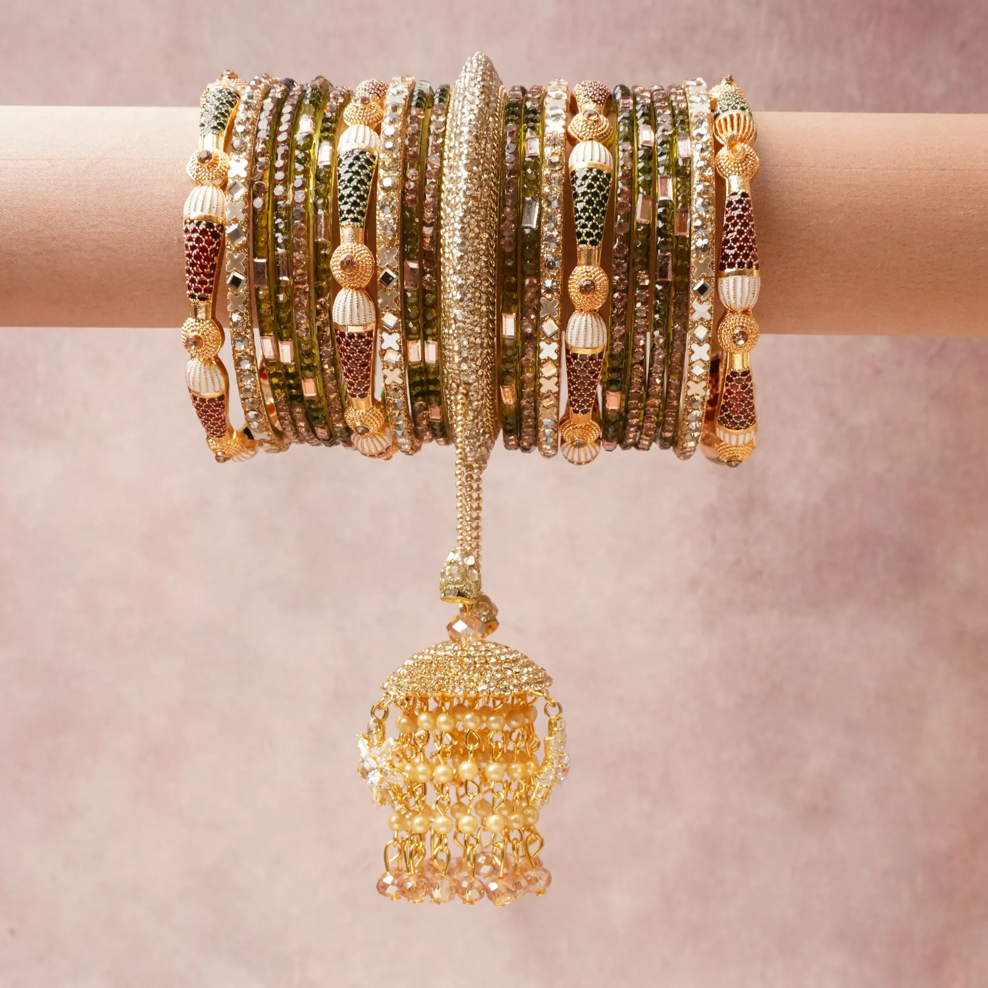 A commanding Green anchors this beautiful set, enriched with accents of Antique Gold, Burgundy, Cream, Clear Crystal, Champagne, Rose Brown that add depth and dimension.

Featuring a striking composition of Gold-plated Brass, Glass, Cubic Zirconia, Enamel, Faux Pearls, Faceted Glass, this set carries intricate craftsmanship and strong presence. Grand in form, it is created for moments that deserve to be marked.